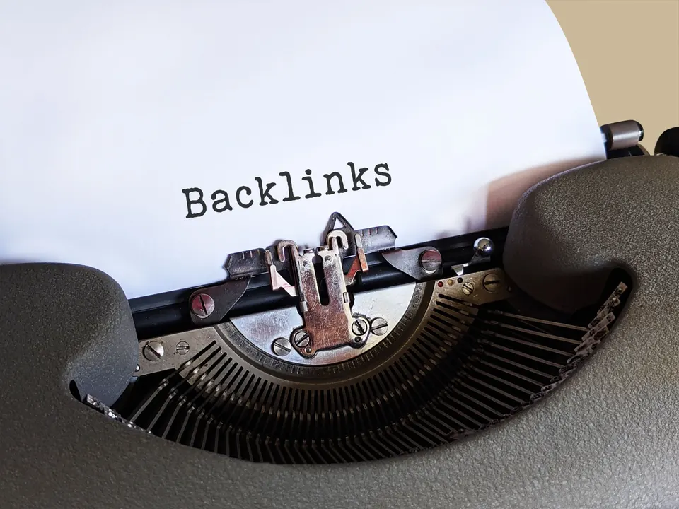 The word Backlinks typed on paper in a vintage typewriter, representing the first steps of a link building roadmap